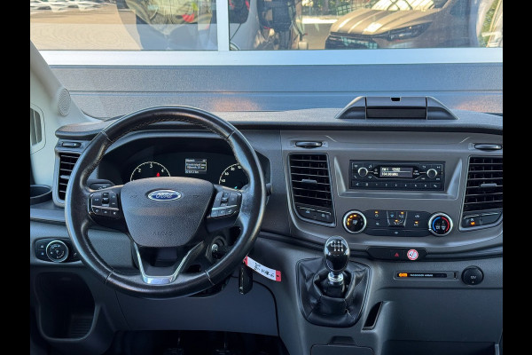 Ford Transit 310 2.0 TDCI 130pk L2H1 DC Trend | Open Laadbak | Trekhaak 2550KG | Airco | Kunstleder | Bluetooth | 7-persoons