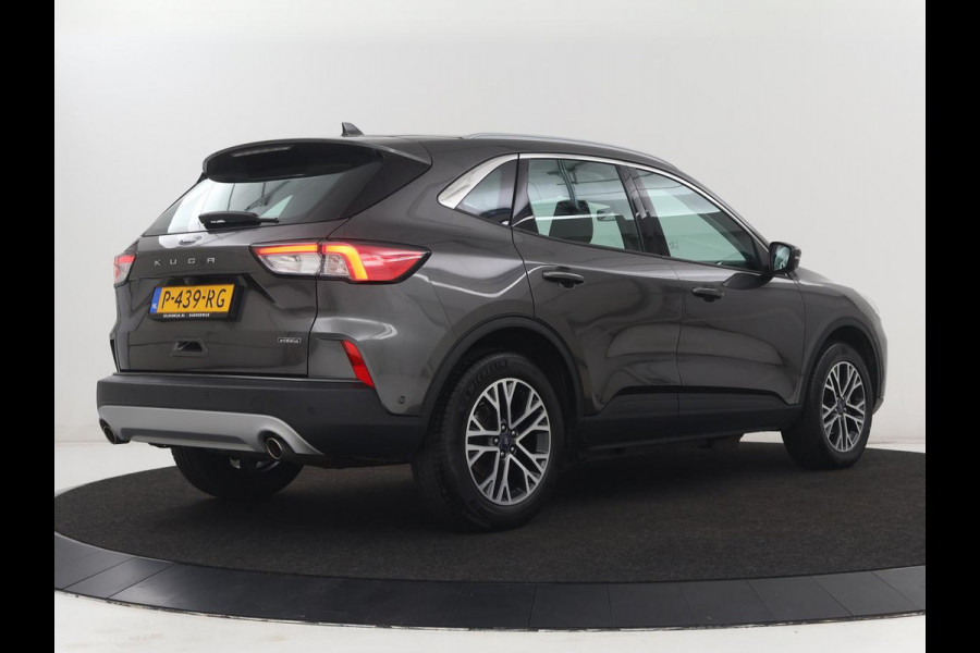 Ford Kuga 2.5 PHEV Titanium | SOH 85,6% | Trekhaak | Stoelverwarming | Camera | Adaptive cruise | Side Assist | Navigatie | Achterbankverwarming | Keyless | Carplay | Plug In