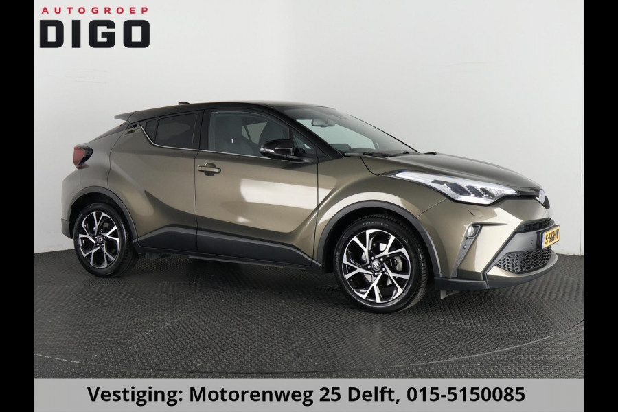 Toyota C-HR 1.8 HYBRID BI-TONE LUXERY LINE GARANTIE 5-2032 TREKHAAK. 4 SEIZOENEN BANDEN.NAVIGATIE. STUUR EN STOELVERWARMING. HALF LEDER