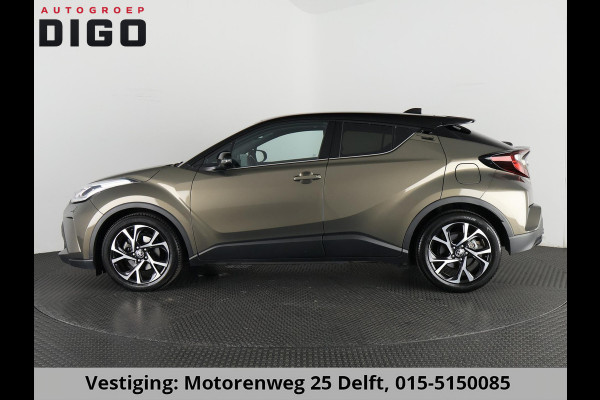 Toyota C-HR 1.8 HYBRID BI-TONE LUXERY LINE GARANTIE 5-2032 TREKHAAK. 4 SEIZOENEN BANDEN.NAVIGATIE. STUUR EN STOELVERWARMING. HALF LEDER