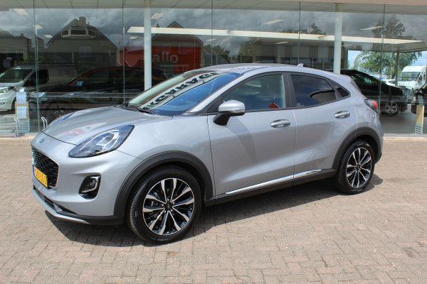 Ford Puma 1.0-125pk EcoBoost Mild-Hybrid Titanium X. Garantie t/m 07-03-2028 ! Slechts 7.400km ! Cruise cntrl, climate cntrl, stoel-, stuur- en voorraamverw., draadloos opladen telefoon, trekhaak afneembaar, navigatie, telefoonvoorb., LM wielen, B&O soundsyst., digitaal dashboard etc.