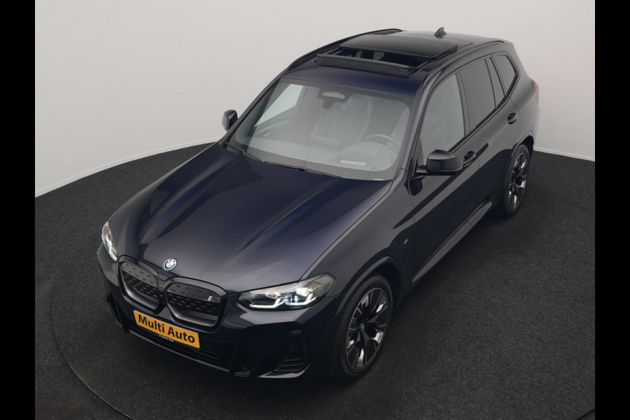 BMW iX3 M Sport 80 kWh 286pk Dealer O.H. | Trekhaak Af Fabriek | Panodak | Head Up | Adaptive Cruise | 360 Camera | Adaptief Onderstel | Harman / Kardon | Lederen Sportstoelen Memory & Verwarmd | Keyless | Blis | Apple Carplay | Sfeerverlichting | Navigatie | DAB | 20"L.M |