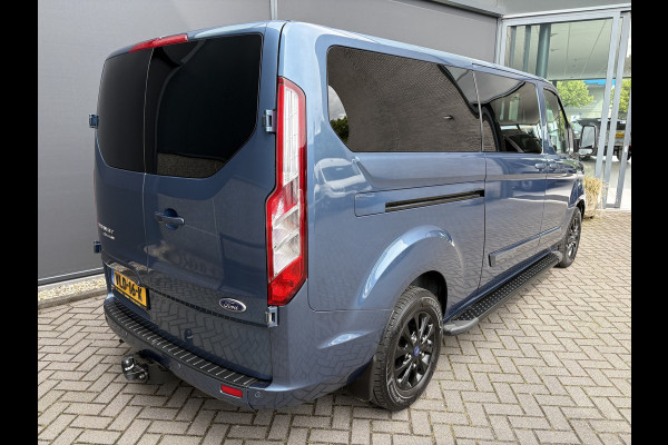 Ford Transit Custom 320 2.0 TDCI L2H1 Platinum Edition DC Automaat Achteruitrijcamera - Parkeersensoren - Navigatie - Airco - Dodehoek detector - Cruise control - Licht metalen velgen 16 inch - Lederen bekleding - Radio - Bluetooth - Dubbele cabine - Tussens - Mistlampen voor - Sidebars - Trekhaak - Voorstoelen verwarmd - Led verlichting - Extra getint glas achter - Start/stop systeem - Stuur multifunctioneel - Stuur leder - Regensensor