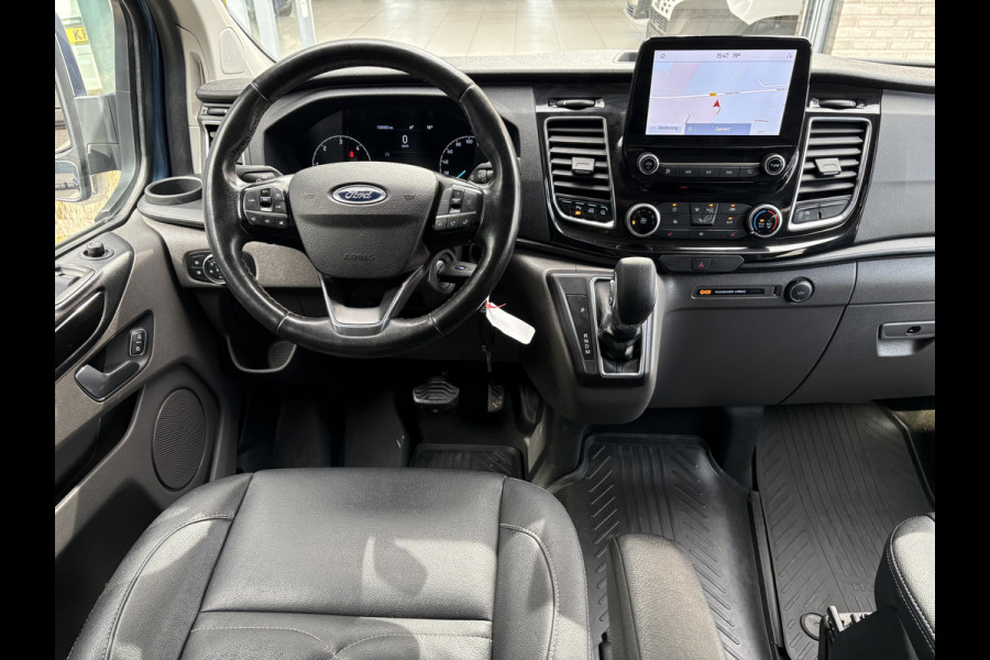 Ford Transit Custom 320 2.0 TDCI L2H1 Platinum Edition DC Automaat Achteruitrijcamera - Parkeersensoren - Navigatie - Airco - Dodehoek detector - Cruise control - Licht metalen velgen 16 inch - Lederen bekleding - Radio - Bluetooth - Dubbele cabine - Tussens - Mistlampen voor - Sidebars - Trekhaak - Voorstoelen verwarmd - Led verlichting - Extra getint glas achter - Start/stop systeem - Stuur multifunctioneel - Stuur leder - Regensensor