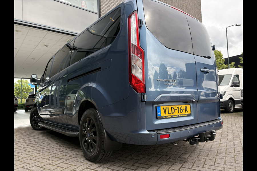 Ford Transit Custom 320 2.0 TDCI L2H1 Platinum Edition DC Automaat Achteruitrijcamera - Parkeersensoren - Navigatie - Airco - Dodehoek detector - Cruise control - Licht metalen velgen 16 inch - Lederen bekleding - Radio - Bluetooth - Dubbele cabine - Tussens - Mistlampen voor - Sidebars - Trekhaak - Voorstoelen verwarmd - Led verlichting - Extra getint glas achter - Start/stop systeem - Stuur multifunctioneel - Stuur leder - Regensensor