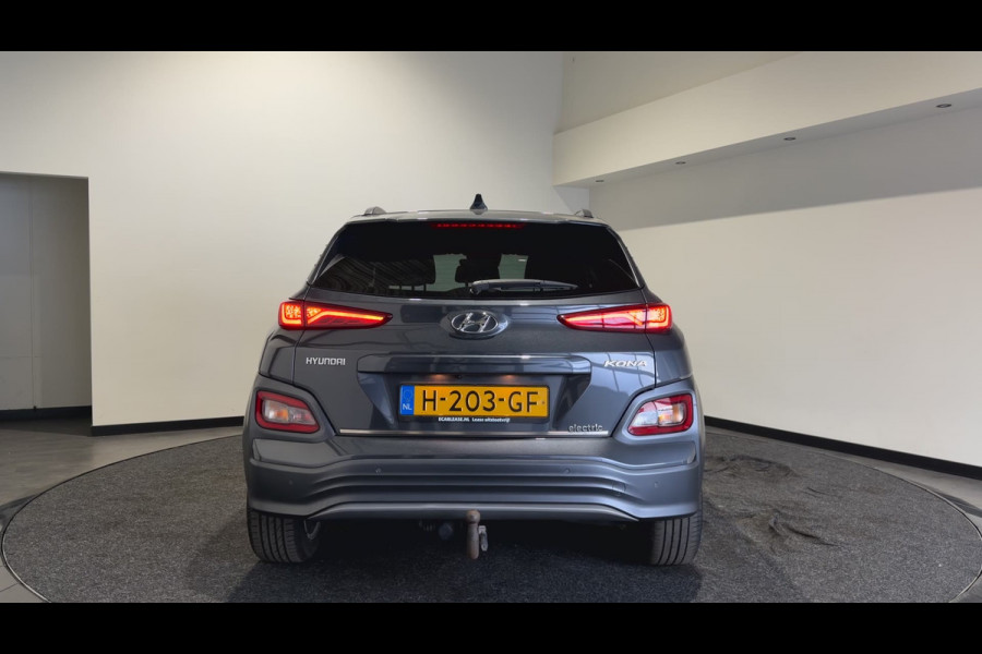 Hyundai Kona EV Premium 64 kWh | Voorstoelen verwarmd & gekoeld | Trekhaak | Warmtepomp | Soh (batterijcheck) Waarde 90,4 %