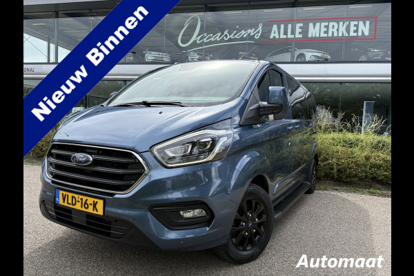 Ford Transit Custom 320 2.0 TDCI L2H1 Platinum Edition DC Automaat Achteruitrijcamera - Parkeersensoren - Navigatie - Airco - Dodehoek detector - Cruise control - Licht metalen velgen 16 inch - Lederen bekleding - Radio - Bluetooth - Dubbele cabine - Tussens - Mistlampen voor - Sidebars - Trekhaak - Voorstoelen verwarmd - Led verlichting - Extra getint glas achter - Start/stop systeem - Stuur multifunctioneel - Stuur leder - Regensensor