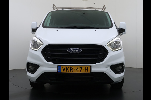 Ford Transit Custom 300 2.0TDCI L2H1 Dubbele Cabine 6-Persoons Trekhaak Navi Camera Cruise Control Imperiaal Airco Stoelverwarming Pdc DC DAB Bluetooth Betonplex Vloer Wandbetimmering 2.750KG Trekgewicht Origineel Nederlandse Auto