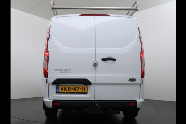 Ford Transit Custom 300 2.0TDCI L2H1 Dubbele Cabine 6-Persoons Trekhaak Navi Camera Cruise Control Imperiaal Airco Stoelverwarming Pdc DC DAB Bluetooth Betonplex Vloer Wandbetimmering 2.750KG Trekgewicht Origineel Nederlandse Auto
