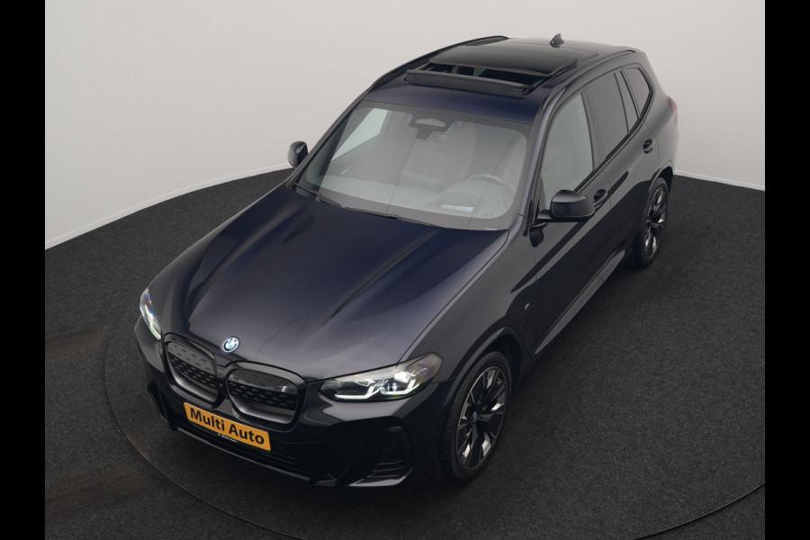 BMW iX3 M Sport 80 kWh 286pk Dealer O.H. | Trekhaak Af Fabriek | Panodak | Head Up | 360 Camera | Harman / Kardon | Lederen Sportstoelen Memory & Verwarmd | Keyless | Blis | Sfeerverlichting | 20"L.M | Adaptive LED |