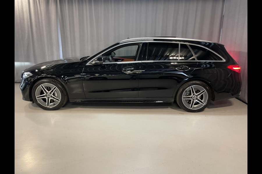 Mercedes-Benz C-Klasse Estate 300 e Star Edition AMG Line 18"/Panoramadak/Trekhaak/Stuur + stoelverwarming/Adaptieve cruise/Dodehoek/Sfeerverlichting premium/Elektrische klep/Apple Carplay & Android Auto