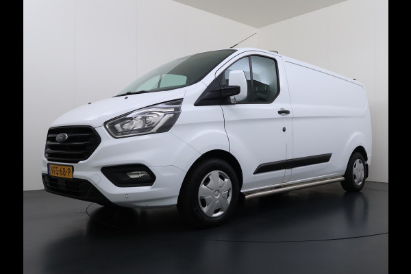 Ford Transit Custom 320 2.0TDCI 130PK L2H1 Camera Trekhaak Stoelverwarming Euro 6 Airco Navi Cruise Control Bluetooth Pdc Trend Sidebars Betonplex Vloer Wandbetimmering Inbouwkasten 2.800KG Trekgewicht Origineel Nederlandse Bus
