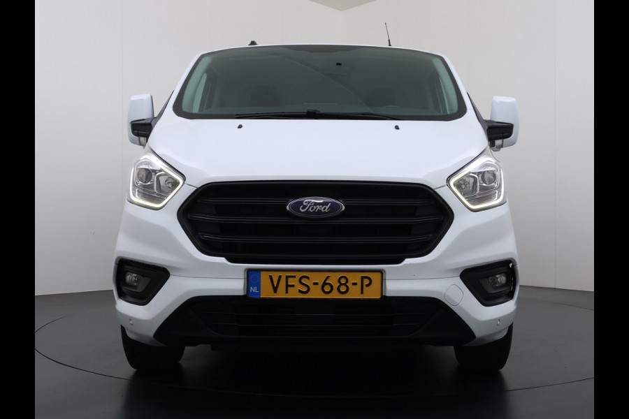 Ford Transit Custom 320 2.0TDCI 130PK L2H1 Camera Trekhaak Stoelverwarming Euro 6 Airco Navi Cruise Control Bluetooth Pdc Trend Sidebars Betonplex Vloer Wandbetimmering Inbouwkasten 2.800KG Trekgewicht Origineel Nederlandse Bus