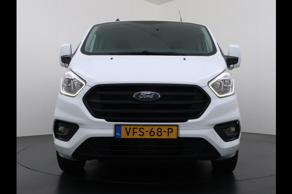 Ford Transit Custom 320 2.0TDCI 130PK L2H1 Camera Trekhaak Stoelverwarming Euro 6 Airco Navi Cruise Control Bluetooth Pdc Trend Sidebars Betonplex Vloer Wandbetimmering Inbouwkasten 2.800KG Trekgewicht Origineel Nederlandse Bus