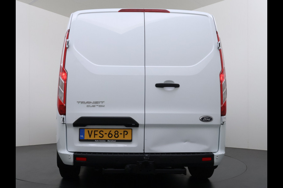 Ford Transit Custom 320 2.0TDCI 130PK L2H1 Camera Trekhaak Stoelverwarming Euro 6 Airco Navi Cruise Control Bluetooth Pdc Trend Sidebars Betonplex Vloer Wandbetimmering Inbouwkasten 2.800KG Trekgewicht Origineel Nederlandse Bus