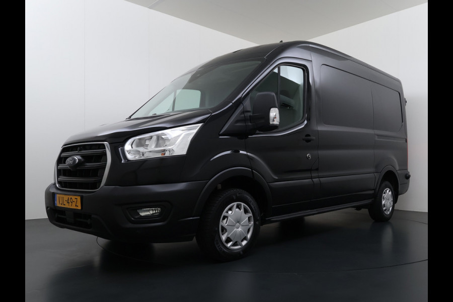 Ford Transit 310 2.0TDCI 130PK L2H2 3-Persoons Navi* Camera Apple Carplay Android Auto Cruise Control Lane Assist Pdc Trend Stoelverwarming Elek.Stoel Wifi DAB Betonplex Vloer Wandbetimmering Schuifdeur 1e Eigenaar Euro 6