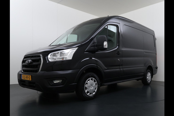 Ford Transit 310 2.0TDCI 130PK L2H2 3-Persoons Navi* Camera Apple Carplay Android Auto Cruise Control Lane Assist Pdc Trend Stoelverwarming Elek.Stoel Wifi DAB Betonplex Vloer Wandbetimmering Schuifdeur 1e Eigenaar Euro 6
