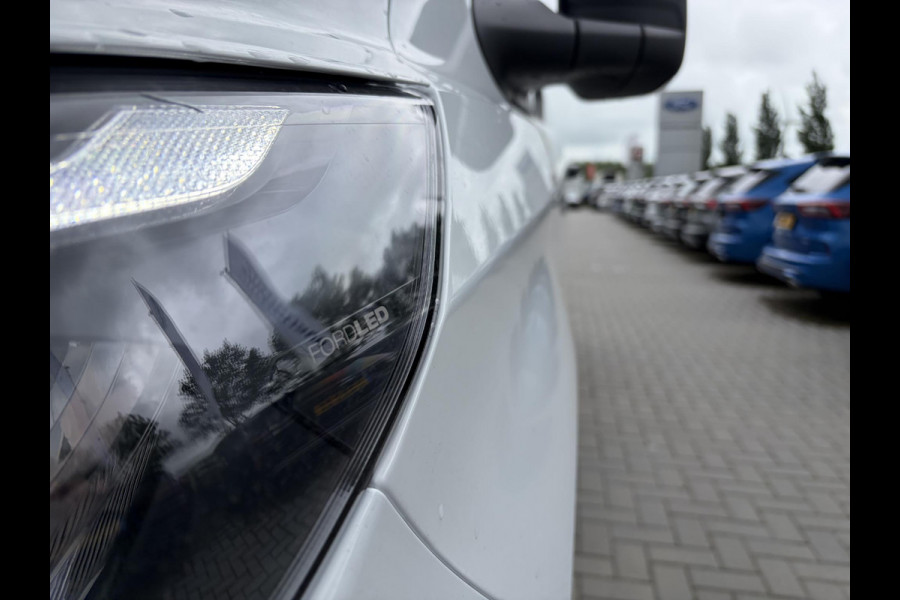 Ford E-Transit Cust. 340 L2H1 Trend 71 kWh ZUID 136pk | Bekleding zijwand en achterdeuren (volledig) | Laadvloer bescherming | 8-weg verstelbare en verwarmbare bestuurdersstoel met armsteun (i.c.m. bijrijdersbank) | Trekhaakvoorbereiding | Allweather banden | AGM accu | Laadkabel 10 | LED laadruimteverlichting (5 spots) | Vehicle Integration System