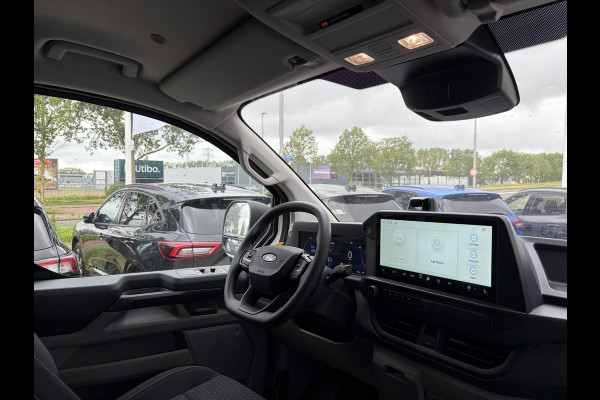 Ford E-Transit Cust. 340 L2H1 Trend 71 kWh ZUID 136pk | Bekleding zijwand en achterdeuren (volledig) | Laadvloer bescherming | 8-weg verstelbare en verwarmbare bestuurdersstoel met armsteun (i.c.m. bijrijdersbank) | Trekhaakvoorbereiding | Allweather banden | AGM accu | Laadkabel 10 | LED laadruimteverlichting (5 spots) | Vehicle Integration System
