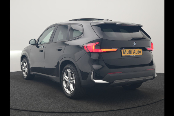 BMW iX1 xDrive30 67 kWh 313pk Dealer O.H. | Trekhaak Af Fabriek | Panodak | Adaptive Cruise | Head Up | 360 Camera | Harman / Kardon | Adaptief Onderstel | Lederen Sportstoelen Massage & Verwarmd | Stuur Verwarmd | Hifi Audio | Keyless | Blis |