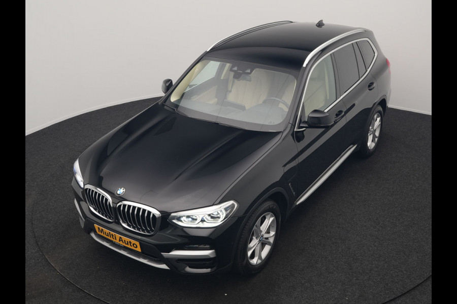 BMW X3 xDrive30e Business Edition Plus PHEV 293pk Dealer O.H. | Trekhaak Af Fabriek | Adaptive Cruise | 360 Camera | Adaptief Onderstel | Lederen Sportstoelen Memory & Ventilatie | Sfeerverlichting | Stoelen & Stuur Verwarmd | Keyless | Blis | Plug In Hybrid |