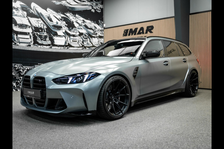 BMW 3 Serie Touring M3 xDrive Competition | Frozen Pure Grey II | WheelForce Velgen | Head-Up Display | Harman Kardon |