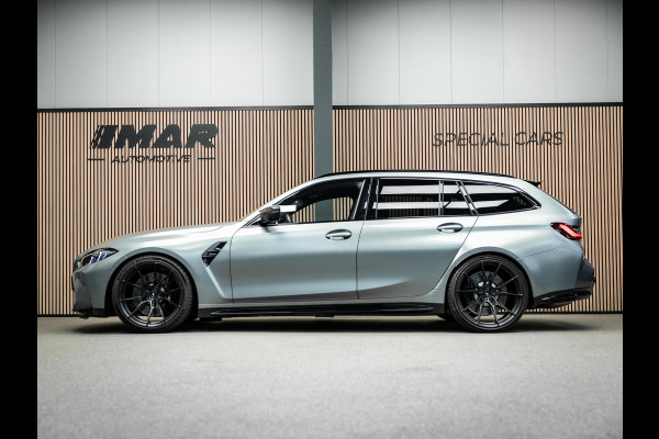 BMW 3 Serie Touring M3 xDrive Competition | Frozen Pure Grey II | WheelForce Velgen | Head-Up Display | Harman Kardon |