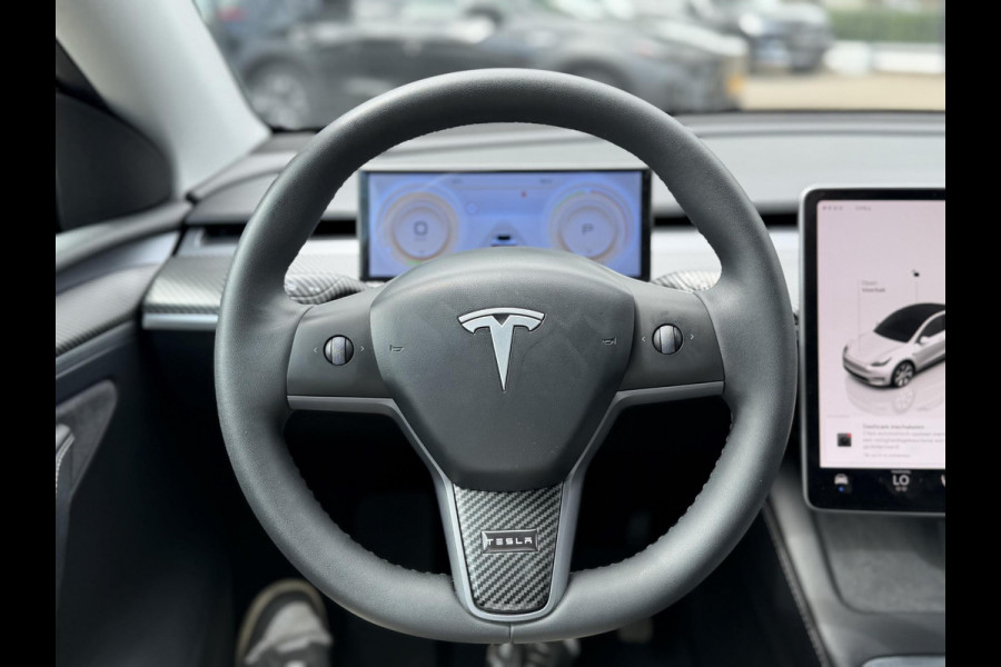 Tesla Model Y RWD 58 kWh UNIEK!| |VAN €35.900:,- VOOR: 32.877,- UW WKVOORDEEL: 3.023,- | STOEL + STUURWIELVERWARMING l CARBON PAKKET | TESLA FABRIEKSGARANTIE  9-2027 OF TOT 80.000 KM |