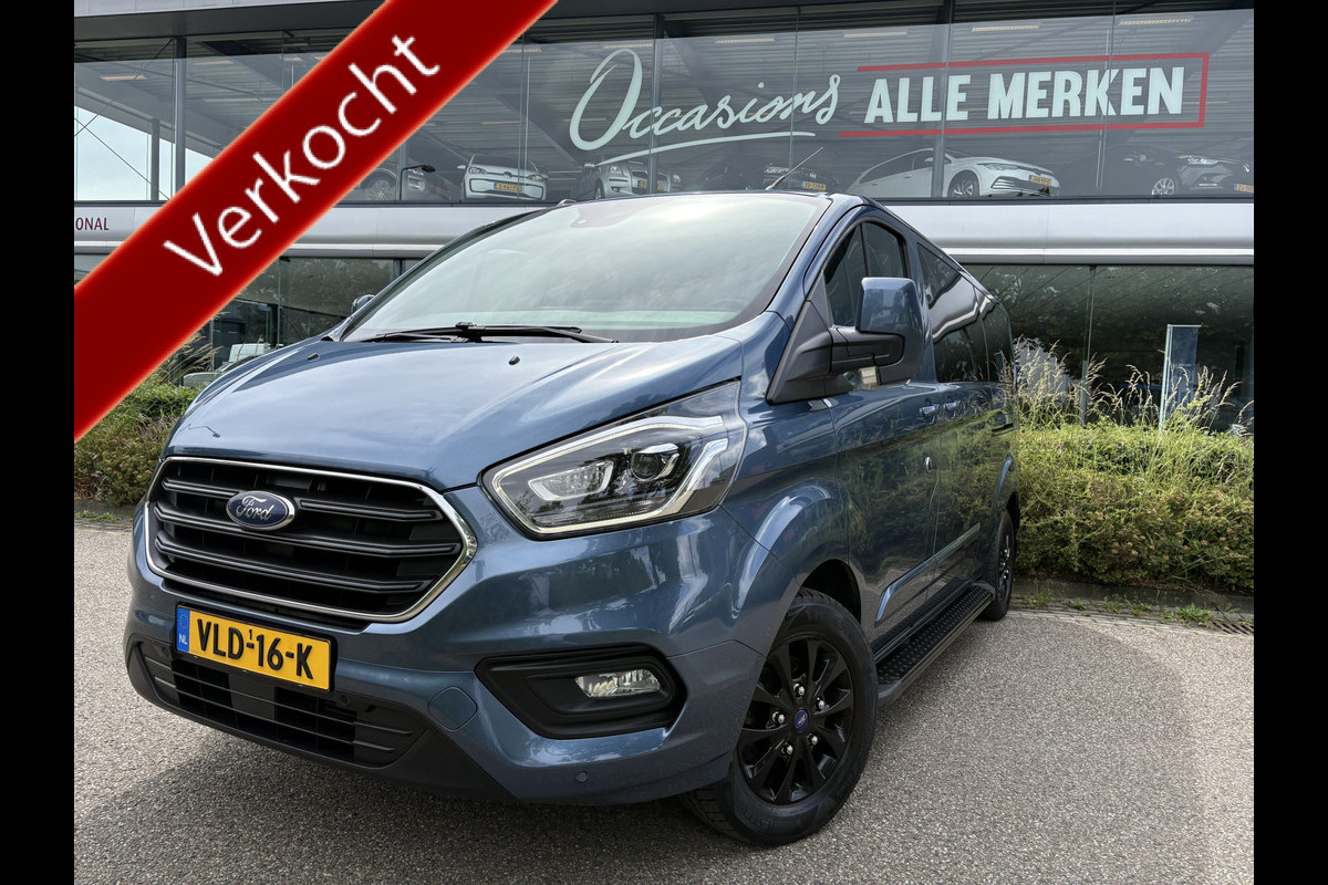 Ford Transit Custom 320 2.0 TDCI L2H1 Platinum Edition DC Automaat Achteruitrijcamera - Parkeersensoren - Navigatie - Airco - Dodehoek detector - Cruise control - Licht metalen velgen 16 inch - Lederen bekleding - Radio - Bluetooth - Dubbele cabine - Tussens - Mistlampen voor - Sidebars - Trekhaak - Voorstoelen verwarmd - Led verlichting - Extra getint glas achter - Start/stop systeem - Stuur multifunctioneel - Stuur leder - Regensensor