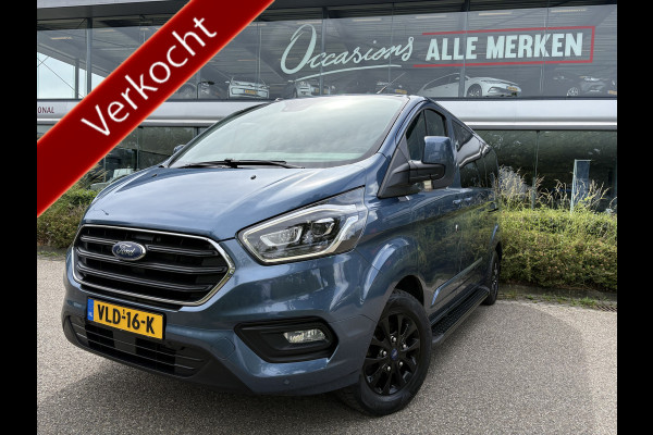 Ford Transit Custom 320 2.0 TDCI L2H1 Platinum Edition DC Automaat Achteruitrijcamera - Parkeersensoren - Navigatie - Airco - Dodehoek detector - Cruise control - Licht metalen velgen 16 inch - Lederen bekleding - Radio - Bluetooth - Dubbele cabine - Tussens - Mistlampen voor - Sidebars - Trekhaak - Voorstoelen verwarmd - Led verlichting - Extra getint glas achter - Start/stop systeem - Stuur multifunctioneel - Stuur leder - Regensensor