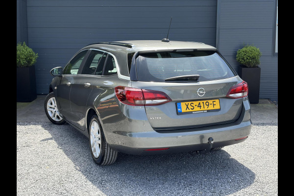 Opel Astra Sports Tourer 1.0 Turbo Business+ 2e Eigenaar,Carplay,Navi,Trekhaak,Dealer Onderhouden,Lm velgen,Pdc,N.A.P,105pk,Clima,Cruise,Recent beurt gehad,Apk tot 03-2027