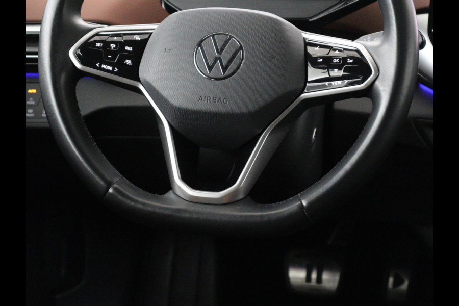 Volkswagen ID.4 Tech 77 kWh | SOH 92,2% | Panorama | 360 Camera | Head up | Virtual cockpit | Sfeerverlichting | Stoel/Stuurverwarming | Adaptive cruise | Carplay | Traffic assist | Climate control | Half leder/velours