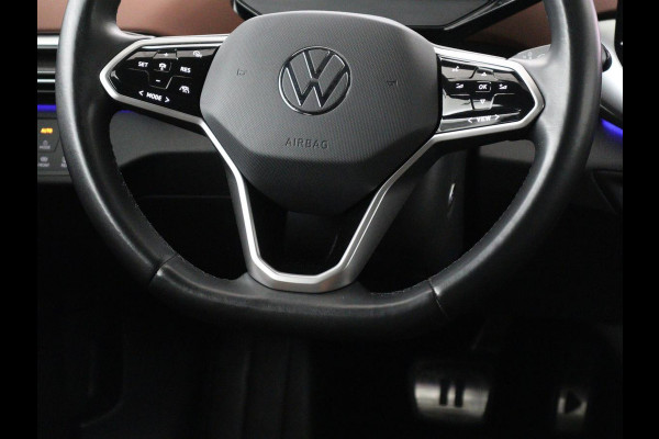 Volkswagen ID.4 Tech 77 kWh | SOH 92,2% | Panorama | 360 Camera | Head up | Virtual cockpit | Sfeerverlichting | Stoel/Stuurverwarming | Adaptive cruise | Carplay | Traffic assist | Climate control | Half leder/velours
