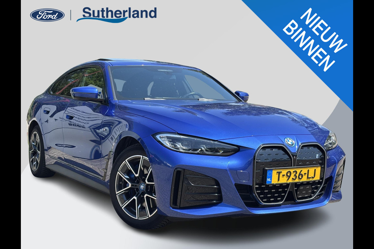 BMW i4 eDrive40 High Executive 84 kWh 340pk | M Sport pakket | Open Dak | Elektrische Achterklep | Adaptieve Cruise | All Season banden