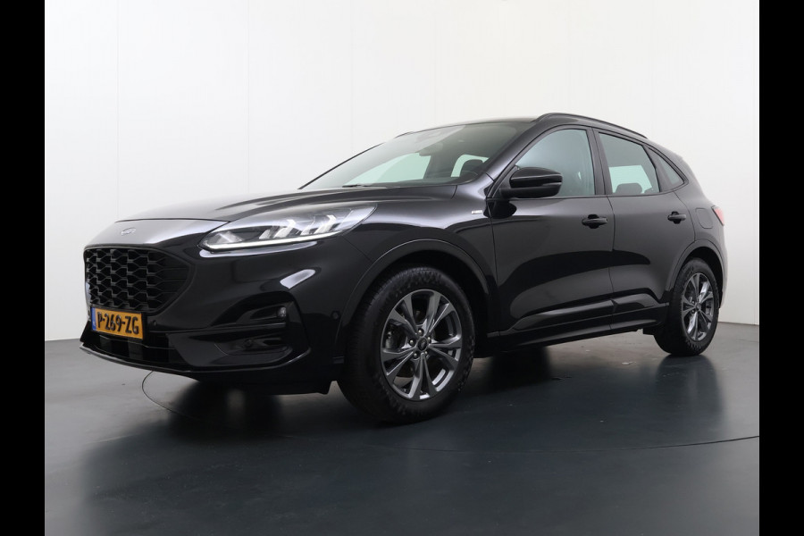 Ford Kuga 1.5T 150PK ST-Line Trekhaak Adap.Cruise Stoel+Stuur+Achterbank+Voorruitverwarming Elek.Achterklep Camera Apple Carplay/Android A Lmv 18" DAB Bluetooth Parkeerhulp Led Lane Assist Isofix Road Edge Detection WiFi 1.800KG Trekgewicht