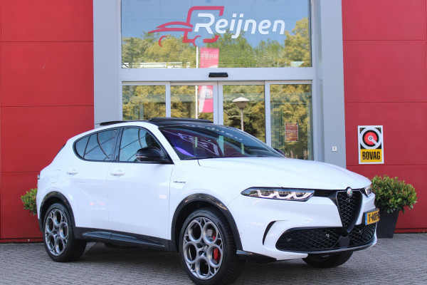 Alfa Romeo Tonale PHEV 280PK VELOCE | PANORAMISCH SCHUIF/KANTEL DAK | PREMIUM PACK: LEDEREN BEKLEDING/GEVENTILEERDE VOORSTOELEN/4-VOUDIG ELEKTRISCH VERSTELBARE LENDESTEUN VOORSTOELEN/HOOGGLANS ZWARTE RAAMOMLIJSTING/AMBIENT LIGHTING | TECHNOLOGY PACK: PARKEERWAARSCHUWING VOOR EN ACHTER/360° CAMERA/AUTOMATISCH INPARKEREN/ AUTONOMOUS DRIVING LEVEL 2: ADAPTIVE CRUISE CONTROL/LANE CENTERING ASSIST/TRAFFIC JAM ASSIST DODEHOEK DETECTIE AUTOMATISCH DIMMENDE BUITENSPIEGELS ELEKTRISCH BEDIENBARE ACHTERKLEP | WINTERPACK: STOELVERWARMING VOOR/STUURVERWARMING/VERWARMBARE RUITENSPROEIERS | HARMAN KAR