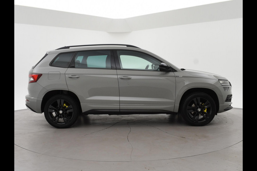 Škoda Karoq 1.5 TSI ACT SPORTLINE + WEGKL. TREKHAAK | VOL LEDER | ADAPTIVE CRUISE | CANTON | CAMERA