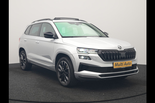 Škoda Karoq 1.5 TSI ACT Sportline Facelift Model 150pk DSG Dealer O.H | Trekhaak Af Fabriek | Adaptive Cruise | Crystal LED | Lederen Sportstoelen Memory & Verwarmd | Keyless | Sfeerverlichting | Apple Carplay | Verwarmd Sportstuur | Navigatie | Virtual | DAB |