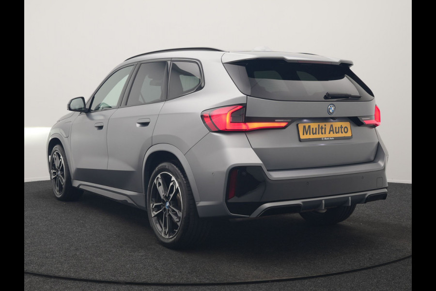 BMW X1 xDrive30e M Sport PHEV Frozen Pure Grey Metallic 326pk Dealer O.H | Trekhaak Af Fabriek | Adaptive Cruise | Head Up | Harman / Kardon | 360 Camera | Alcantara Sportstoelen Massage & Memory | Adaptive Onderstel | Widescreen Navi | Stoelen & Stuur Verwarmd | Blis | Keyless | Apple Carplay | Pilot Assist | Virtual | DAB | 19"L.M | Plug In Hybrid |