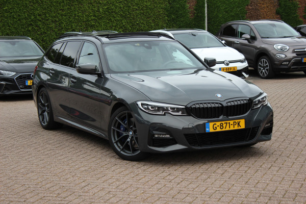 BMW 3 Serie Touring 330i High Exe. M Sport / Panoramadak / Camera / Leder / CarPlay / 19'' / Sportstoelen / Stoelverwarming / DAB / Cruise Control / Getint glas