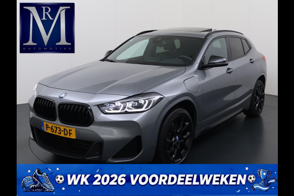 BMW X2 xDrive25e M SPORT Business Edition Plus VAN: 31.900,- VOOR: 29.330,- UW WKVOORDEEL: 2.570,- | BOMVOL | PHEV| PANO| NAP| STOEL + STUURVERWARMING| COMFORT ACCESS| ELEK. ACHTERKLEP| AFNEEMBARE TREKHAAK| HUD| ACHTERUITRIJCAMERA| APPLE CARPLAY
