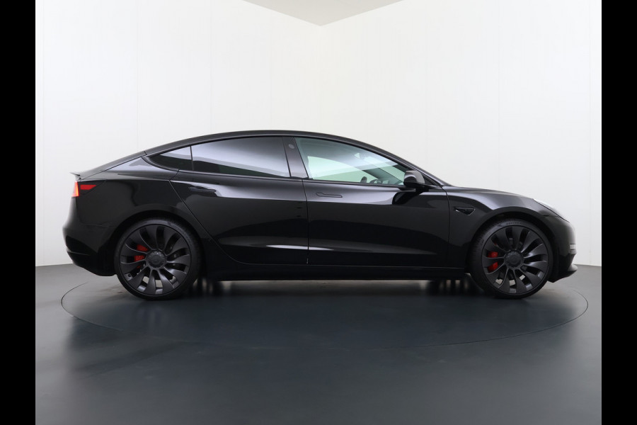 Tesla Model 3 Performance AWD 513PK Facelift Warmtepomp Lmv 20" Panoramadak Adap.Cruise Elek.Verwarmde Stoelen+Memory Inductieladen Navi Camer SOH 85.6% Led Pdc Privacy Glas Elek.Achterklep Keyless 4WD Fabrieksgarantie op Accu en Motor tot 18-02-2029/192.000KM