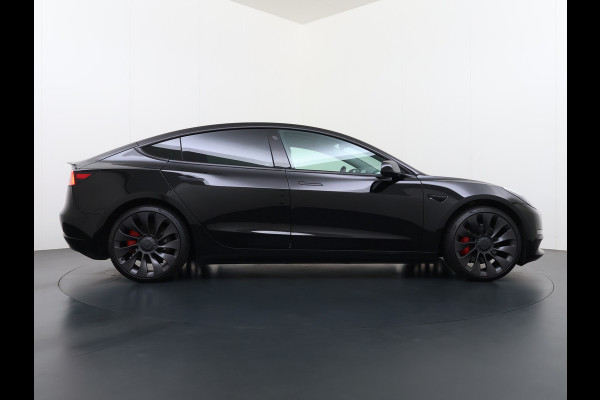 Tesla Model 3 Performance AWD 513PK Facelift Warmtepomp Lmv 20" Panoramadak Adap.Cruise Elek.Verwarmde Stoelen+Memory Inductieladen Navi Camer SOH 85.6% Led Pdc Privacy Glas Elek.Achterklep Keyless 4WD Fabrieksgarantie op Accu en Motor tot 18-02-2029/192.000KM