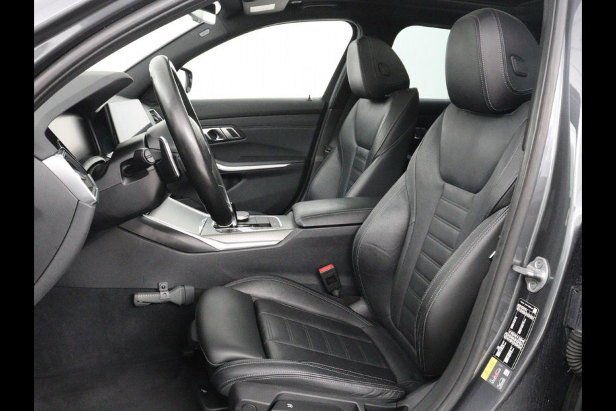 BMW 3 Serie Touring 320e Business Edition Plus M-sport | 84,4% SOH | Panoramadak | Leder | Elektrische trekhaak | Camera | Park assist | Cruise control | Carplay | Sfeerverlichting |