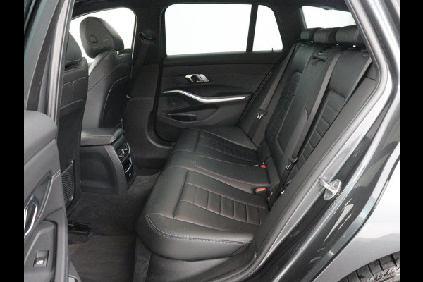 BMW 3 Serie Touring 320e Business Edition Plus M-sport | 84,4% SOH | Panoramadak | Leder | Elektrische trekhaak | Camera | Park assist | Cruise control | Carplay | Sfeerverlichting |