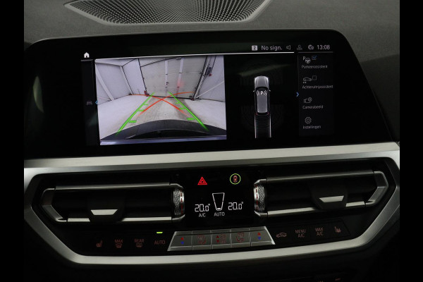 BMW 3 Serie Touring 320e Business Edition Plus M-sport | 84,4% SOH | Panoramadak | Leder | Elektrische trekhaak | Camera | Park assist | Cruise control | Carplay | Sfeerverlichting |