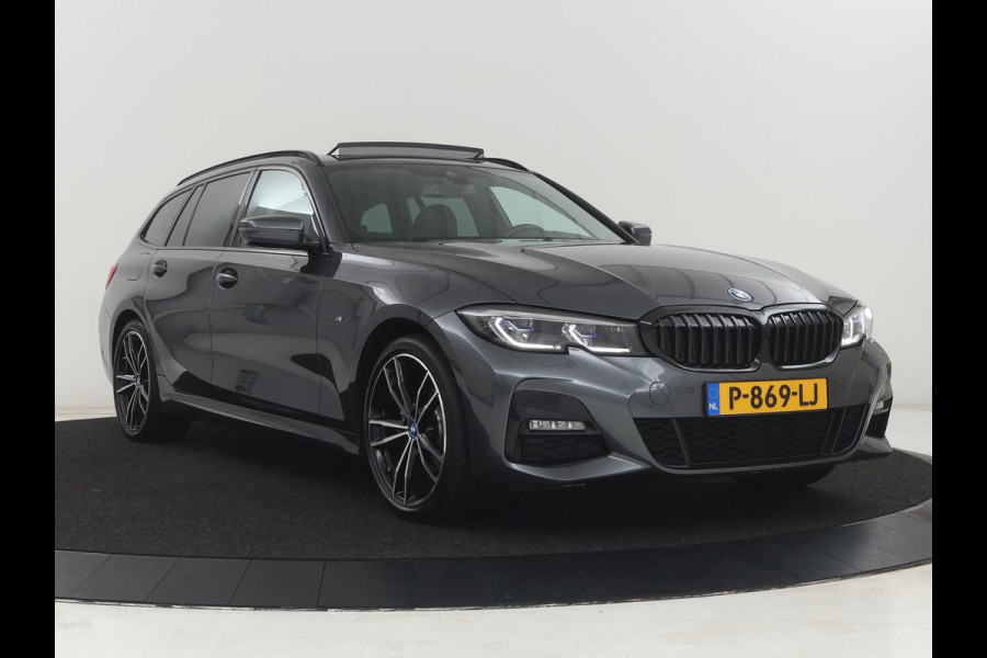 BMW 3 Serie Touring 320e Business Edition Plus M-sport | 84,4% SOH | Panoramadak | Leder | Elektrische trekhaak | Camera | Park assist | Cruise control | Carplay | Sfeerverlichting |