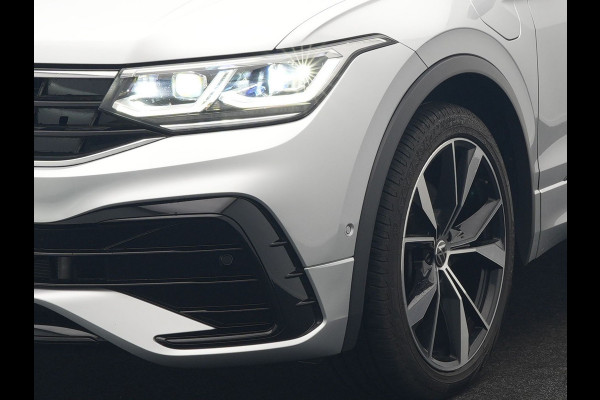 Volkswagen Tiguan 1.4 TSI eHybrid R-Line PHEV 245pk Dealer O.H | Trekhaak Af Fabriek | Adaptive Cruise | IQ Light | Adaptive Onderstel | Camera | Alcantara Sportstoelen & Stuur Verwarmd | Blis | Keyless | Sfeerverlichting | Virtual | Navigatie | DAB | 20"L.M | Plug In Hybrid |