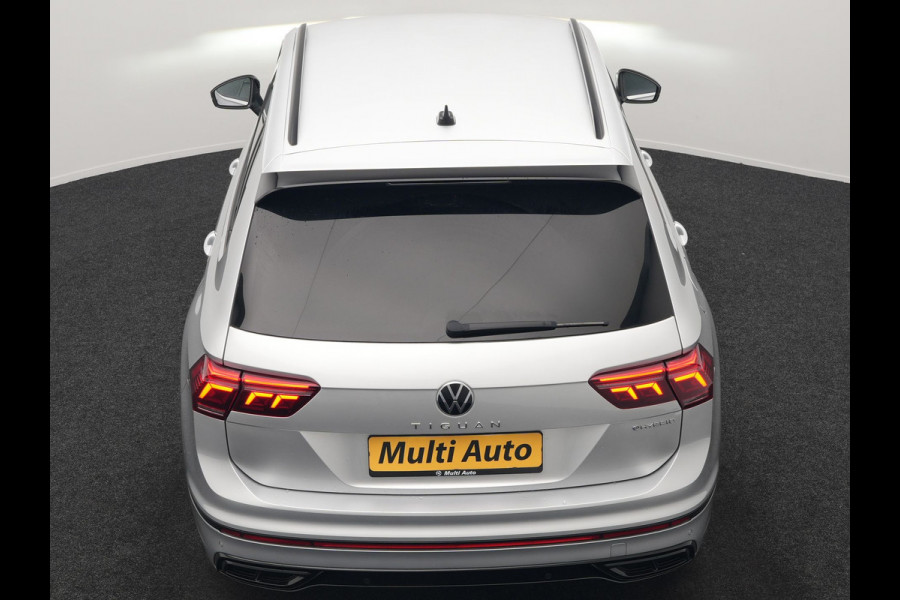 Volkswagen Tiguan 1.4 TSI eHybrid R-Line PHEV 245pk Dealer O.H | Trekhaak Af Fabriek | Adaptive Cruise | IQ Light | Adaptive Onderstel | Camera | Alcantara Sportstoelen & Stuur Verwarmd | Blis | Keyless | Sfeerverlichting | Virtual | Navigatie | DAB | 20"L.M | Plug In Hybrid |