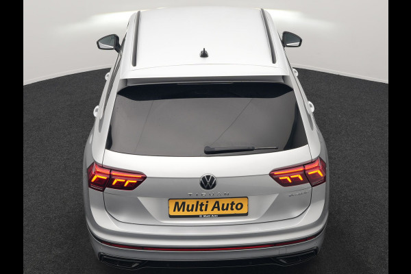 Volkswagen Tiguan 1.4 TSI eHybrid R-Line PHEV 245pk Dealer O.H | Trekhaak Af Fabriek | Adaptive Cruise | IQ Light | Adaptive Onderstel | Camera | Alcantara Sportstoelen & Stuur Verwarmd | Blis | Keyless | Sfeerverlichting | Virtual | Navigatie | DAB | 20"L.M | Plug In Hybrid |
